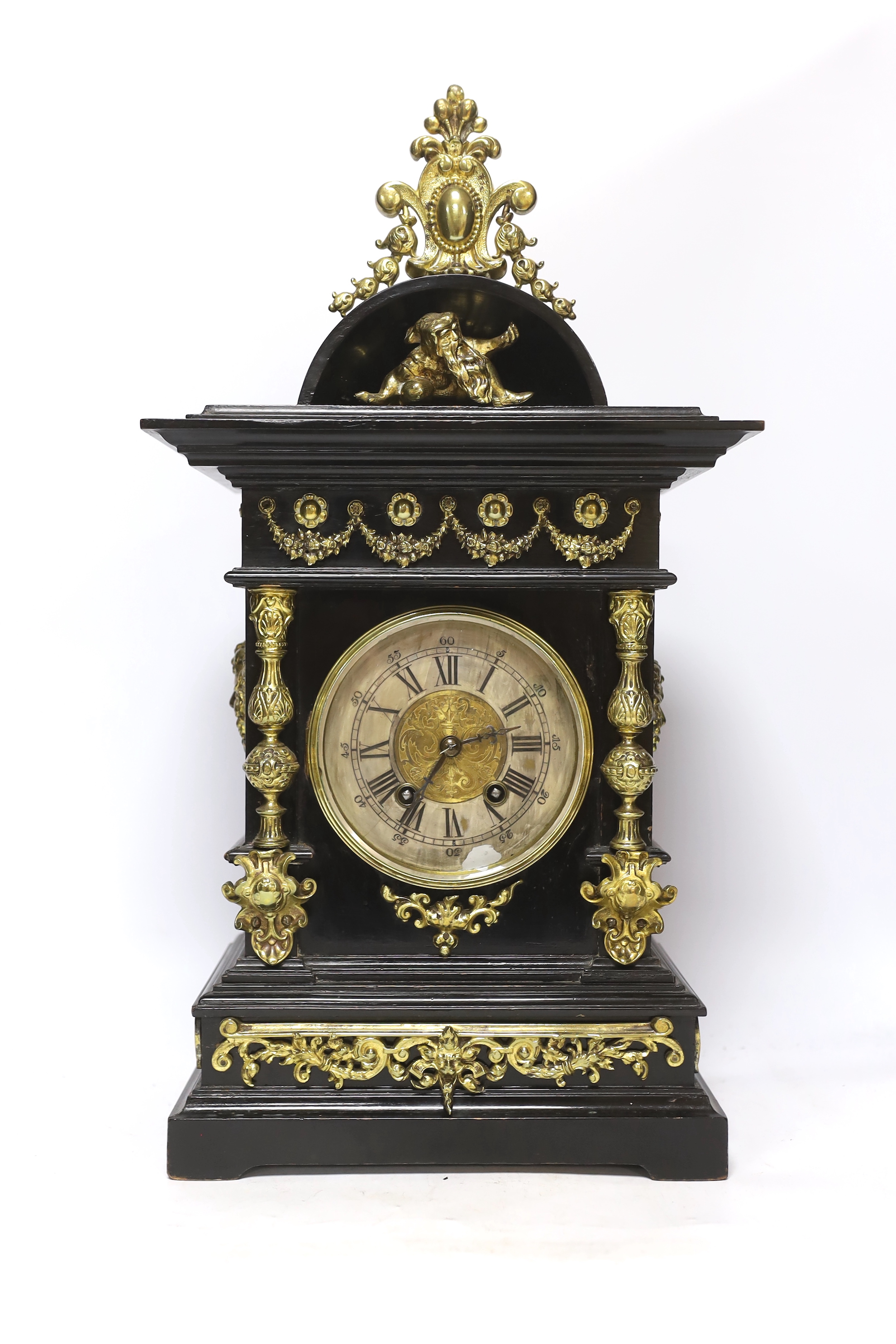 An ebonised German bracket clock with brass decoration, with a Lenzkirch movement striking on a coiled gong, 53cm high, with bracket